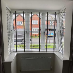 white Venetian blinds with tapes