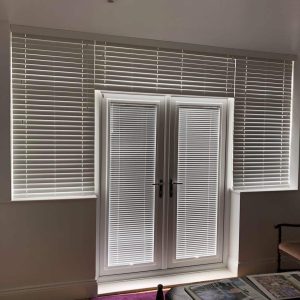 Venetian blinds on door and surrounding windows