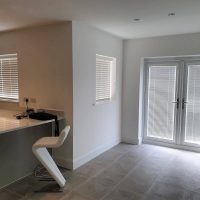 white Venetian blinds in ultra modern kitchen