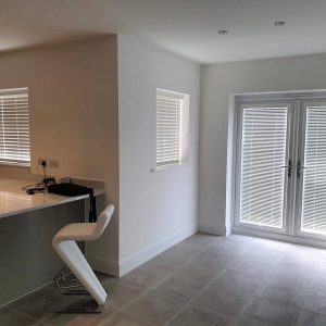 white Venetian blinds in ultra modern kitchen