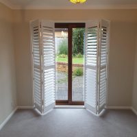 partially folded tracked shutters