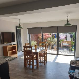 grey electric blinds, roller blinds on bi-fold doors