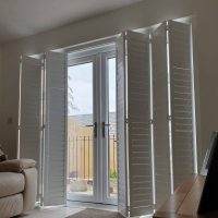 tracked shutters folding back