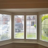 white wooden shutters