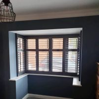 dark painted plantation shutters