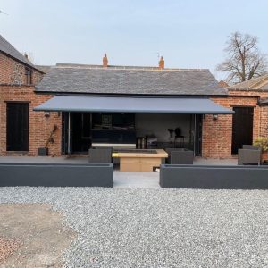 Custom garden awnings in a charcoal grey colour in Rugby