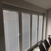 Venetian blinds on bi-fold doors