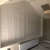 unusual shape window with bespoke shutters