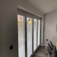 Venetian blinds on bi-fold doors