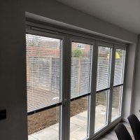 Venetian blinds on bi-fold doors