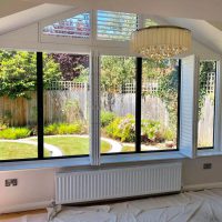 unusual shape window with bespoke shutters