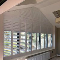 unusual shape window with bespoke shutters