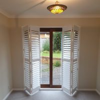 Tracked shutters on patio doors in Northampton by Fraser James Blinds