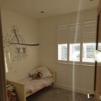 White shutters in a child's bedroom in Northampton by Fraser James Blidns