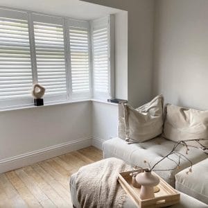 Wooden shutters in white stylish house