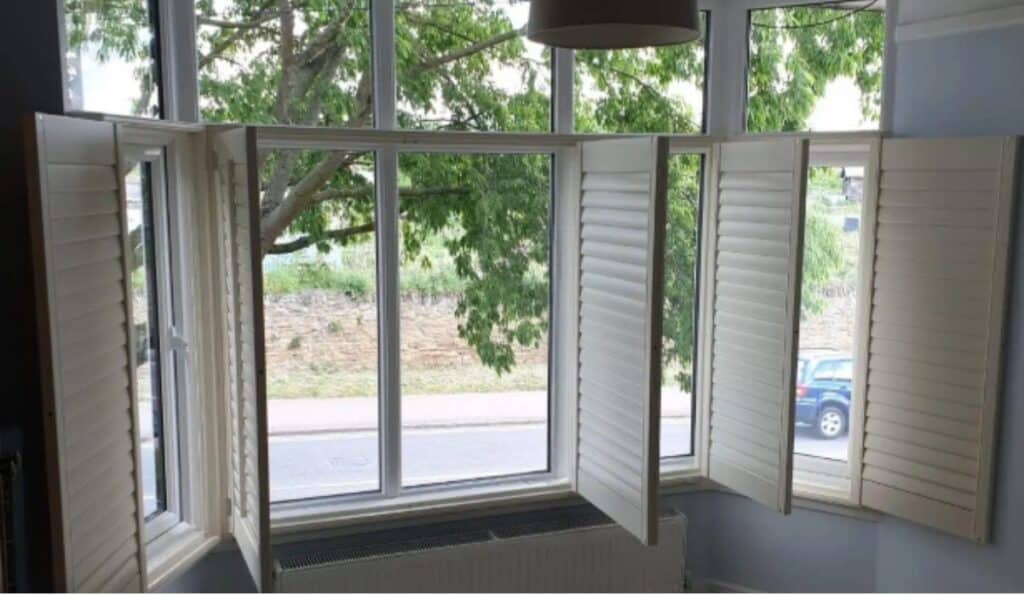 an image showing open door cafe style shutters, showing a large amount of light coming through.